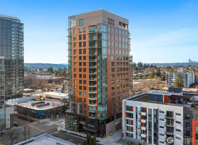 a spacious bedroom with a large bed and large windows