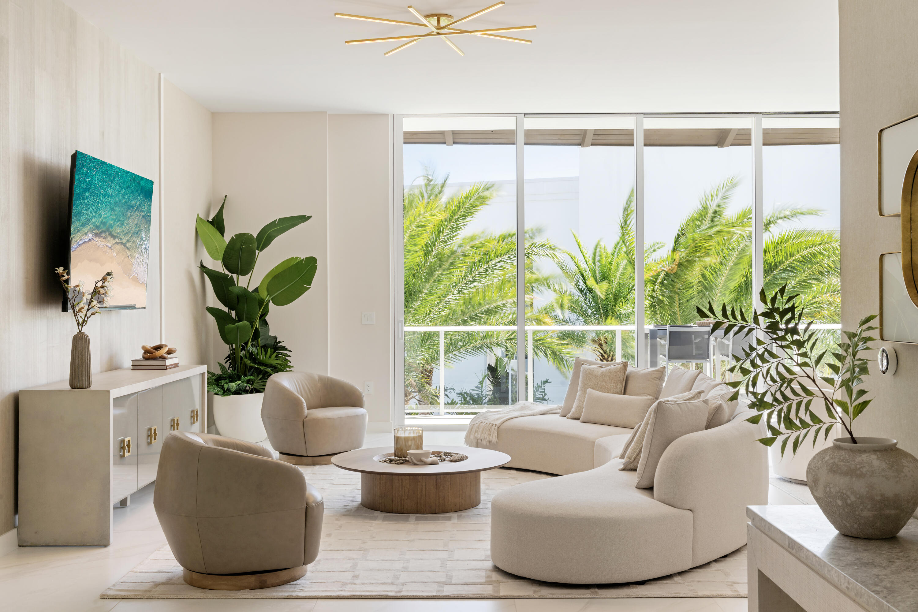 220 Southeast Mizner Boulevard, Unit PH907 Boca Raton, FL 33432 - Photo 2 of 29 a living room with furniture and a potted plant