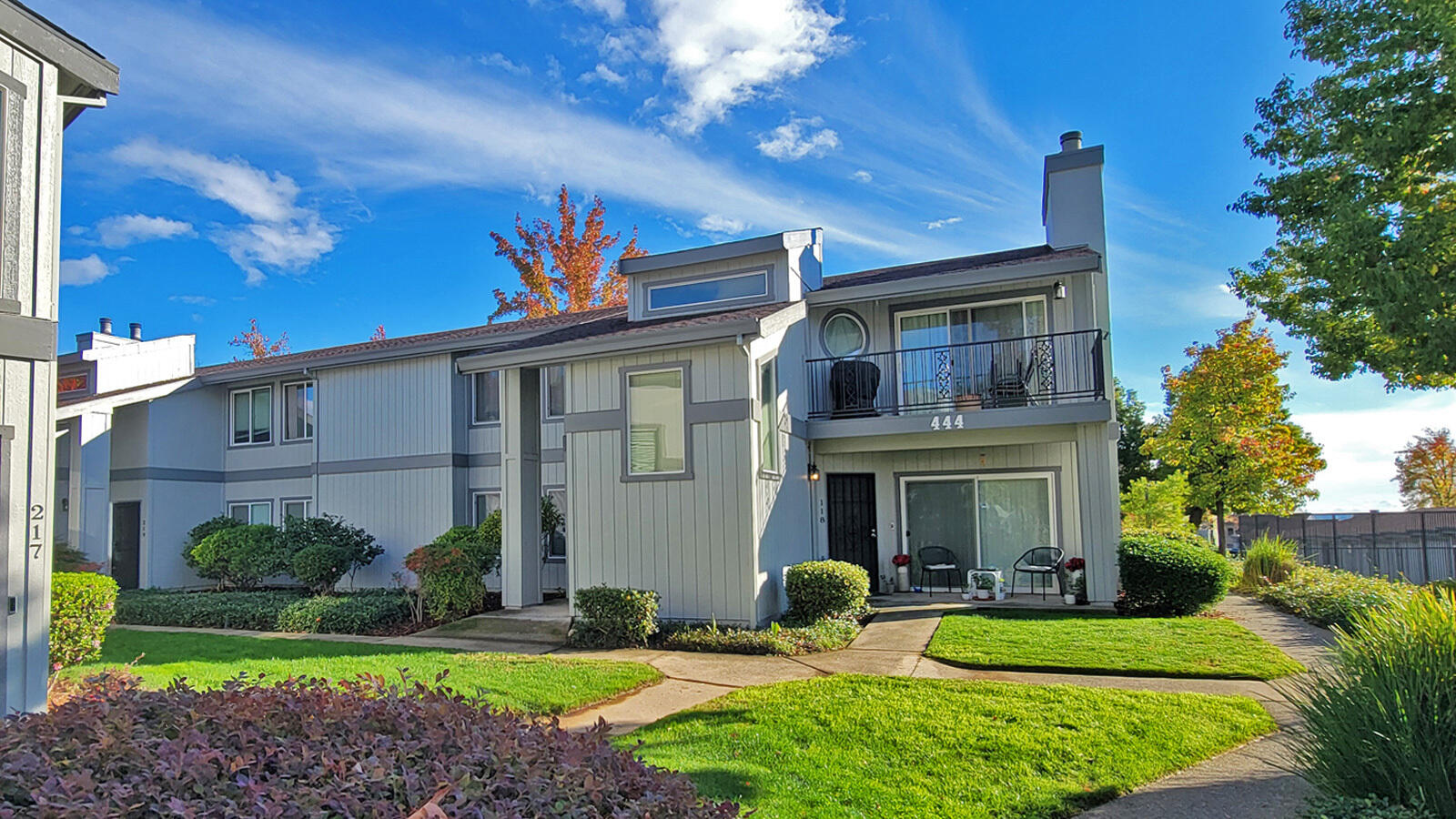 444 Ridgecrest Trail, Unit 119 Redding, CA 96003 - Photo 1 of 16 a view of a house with a yard and potted plants