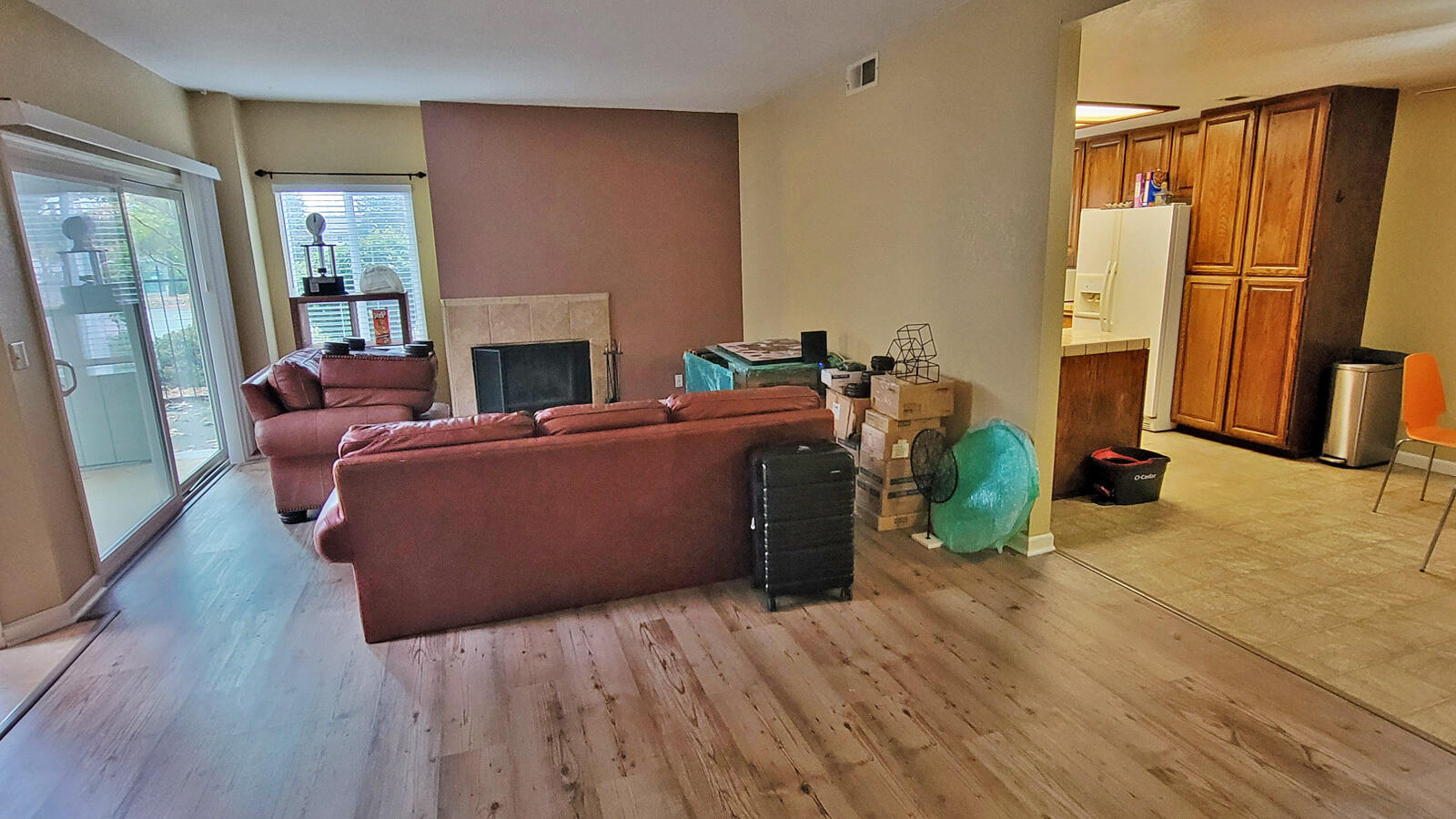 444 Ridgecrest Trail, Unit 119 Redding, CA 96003 - Photo 6 of 16 a living room with furniture a fireplace and a wooden floor