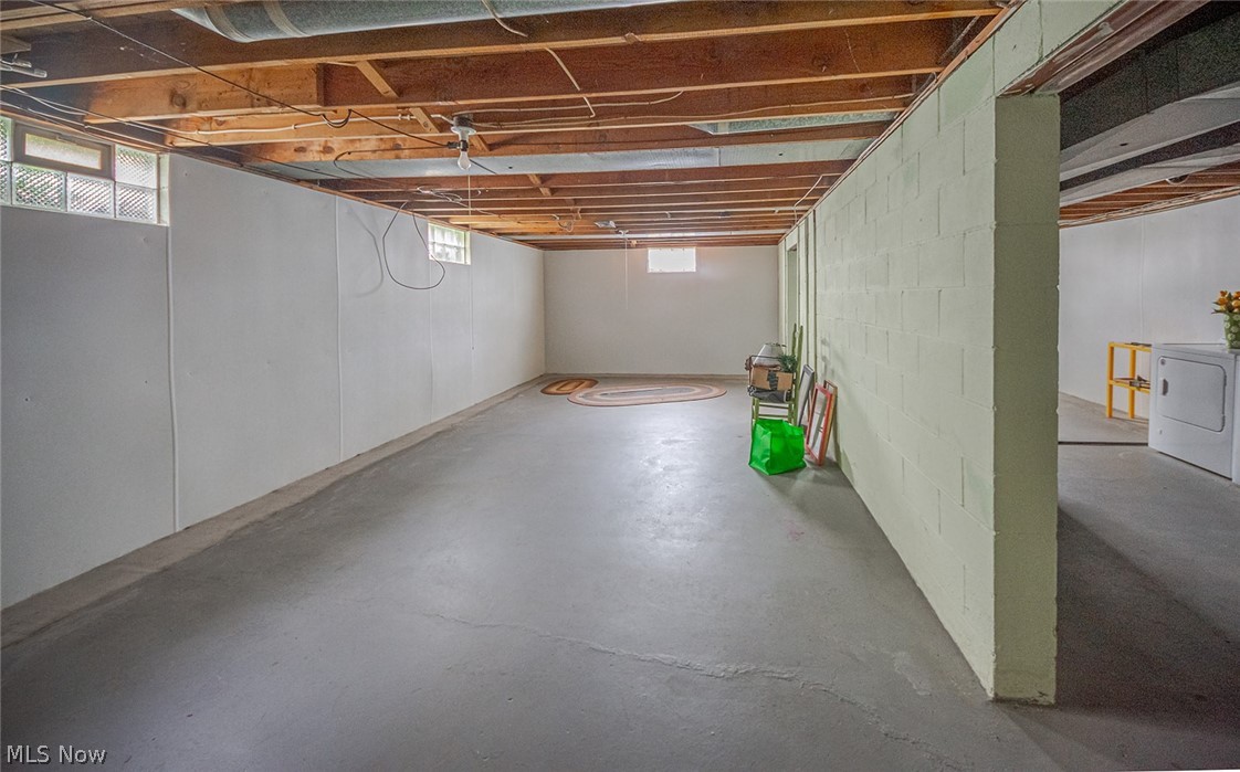 3331 Boyne Road Barberton, OH 44203 - Photo 16 of 22 Unfinished basement with glass block windows and laundry area.