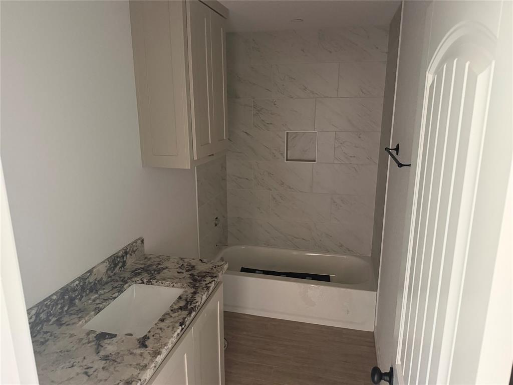 312 Myers Drive Springtown, TX 76082 - Photo 6 of 6 a bathroom with a sink and a mirror