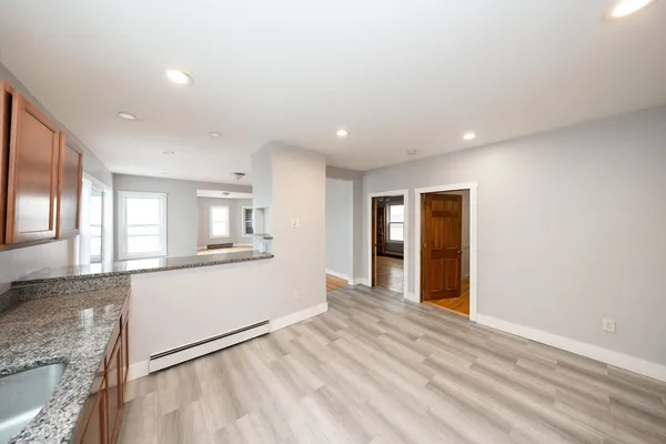 a view of a kitchen cabinets and windows
