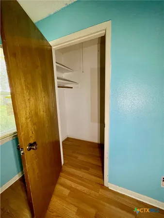a view of front door with wooden floor