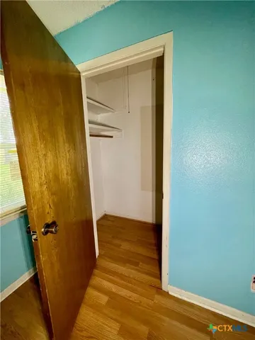 a view of front door with wooden floor