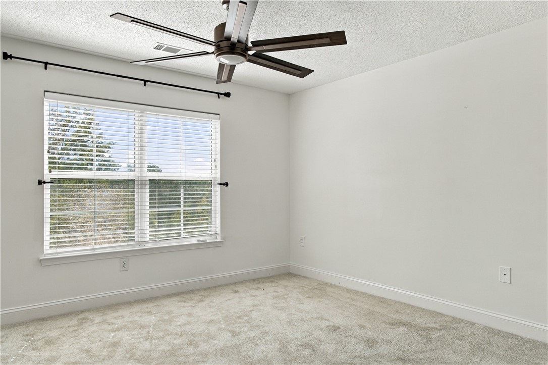 636 Lookover Drive Anderson, SC 29621 - Photo 26 of 34 Plush carpeting and a wide window create a comfortable and inviting atmosphere in this room.