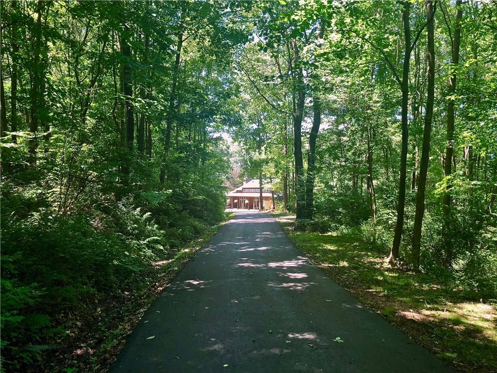 130 Lions Road Butler, PA 16001 - Photo 23 of 25 Guests will be impressed as they wind down the 800 feet of wood lined paved driveway leading to your private oasis.