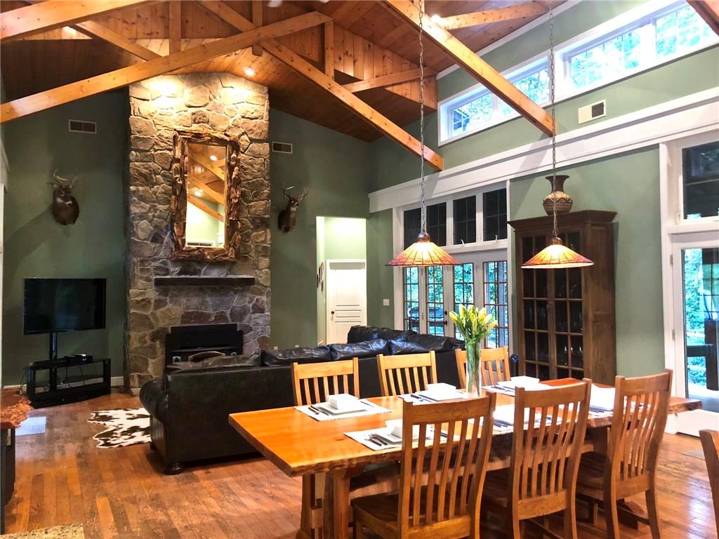 130 Lions Road Butler, PA 16001 - Photo 6 of 25 Floor to ceiling stone fireplace in the living area creates a warm and cozy gathering spot with views of front and rear yards and porches.