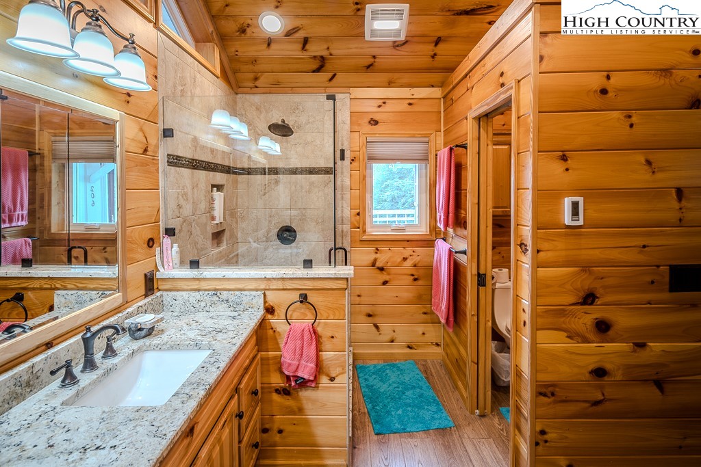 206 Pinnacle Ridge Road Beech Mountain, NC 28604 - Photo 24 of 41 a view of a bathroom with a tub and shower