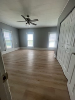 31383 East Five Points Road Kingston, IL 60145 - Photo 13 of 25 a view of an empty room with wooden floor and a window