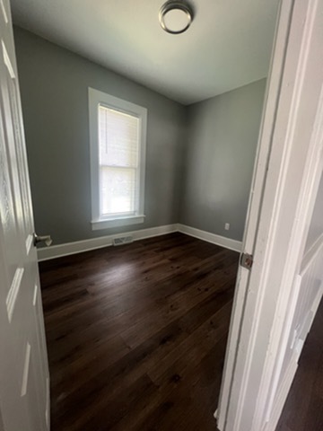 31383 East Five Points Road Kingston, IL 60145 - Photo 15 of 25 a view of an empty room with wooden floor and a window