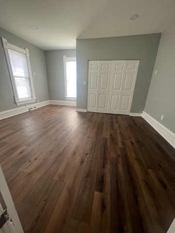 31383 East Five Points Road Kingston, IL 60145 - Photo 16 of 25 an empty room with wooden floor and windows
