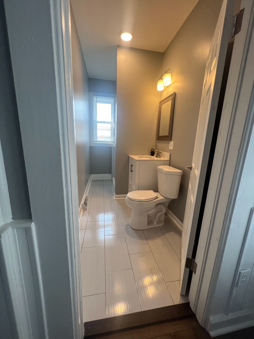 31383 East Five Points Road Kingston, IL 60145 - Photo 4 of 25 a view of a bathroom with a sink and a mirror