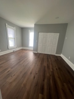 31383 East Five Points Road Kingston, IL 60145 - Photo 7 of 25 an empty room with wooden floor and windows