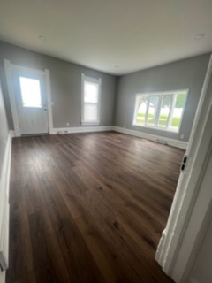 31383 East Five Points Road Kingston, IL 60145 - Photo 8 of 25 an empty room with wooden floor and windows