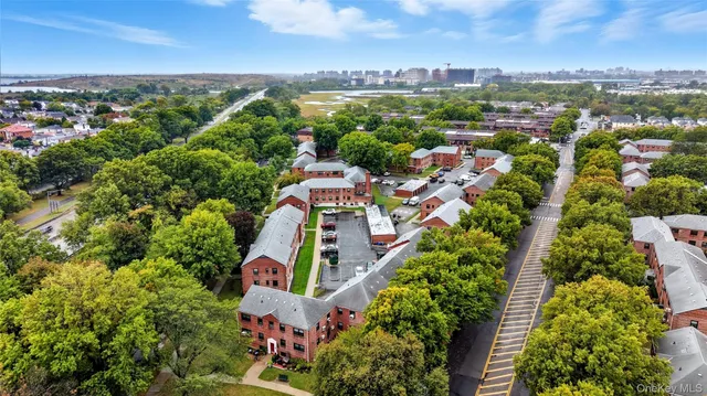 an aerial view of house with yard swimming pool and ocean view