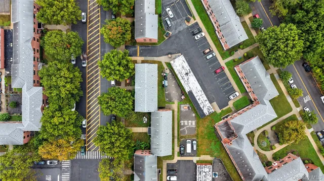 aerial view of a house with a yard