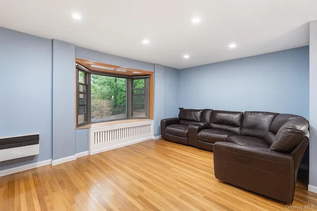 a living room with a couch and a large window