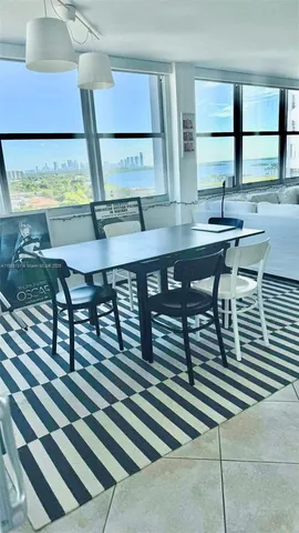 a view of a workspace room with furniture