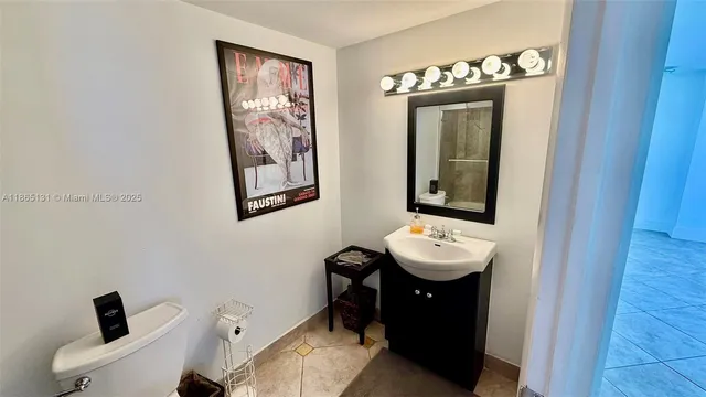 a bathroom with a sink and mirror