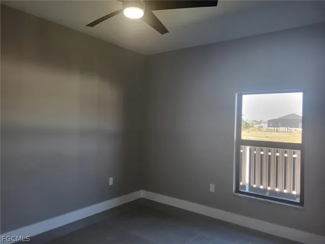 a view of a lake with a yard and trees