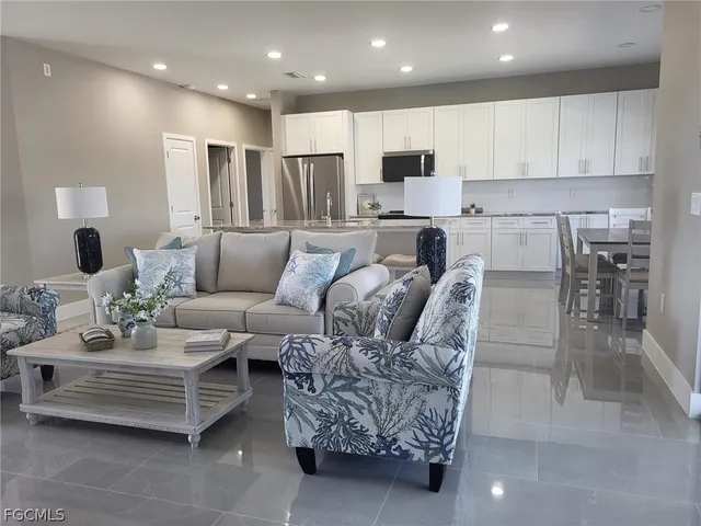 a living room with furniture and a table
