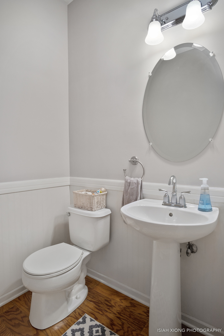 3255 Marbill Farm Road Montgomery, IL 60538 - Photo 7 of 22 a bathroom with a toilet a sink and mirror