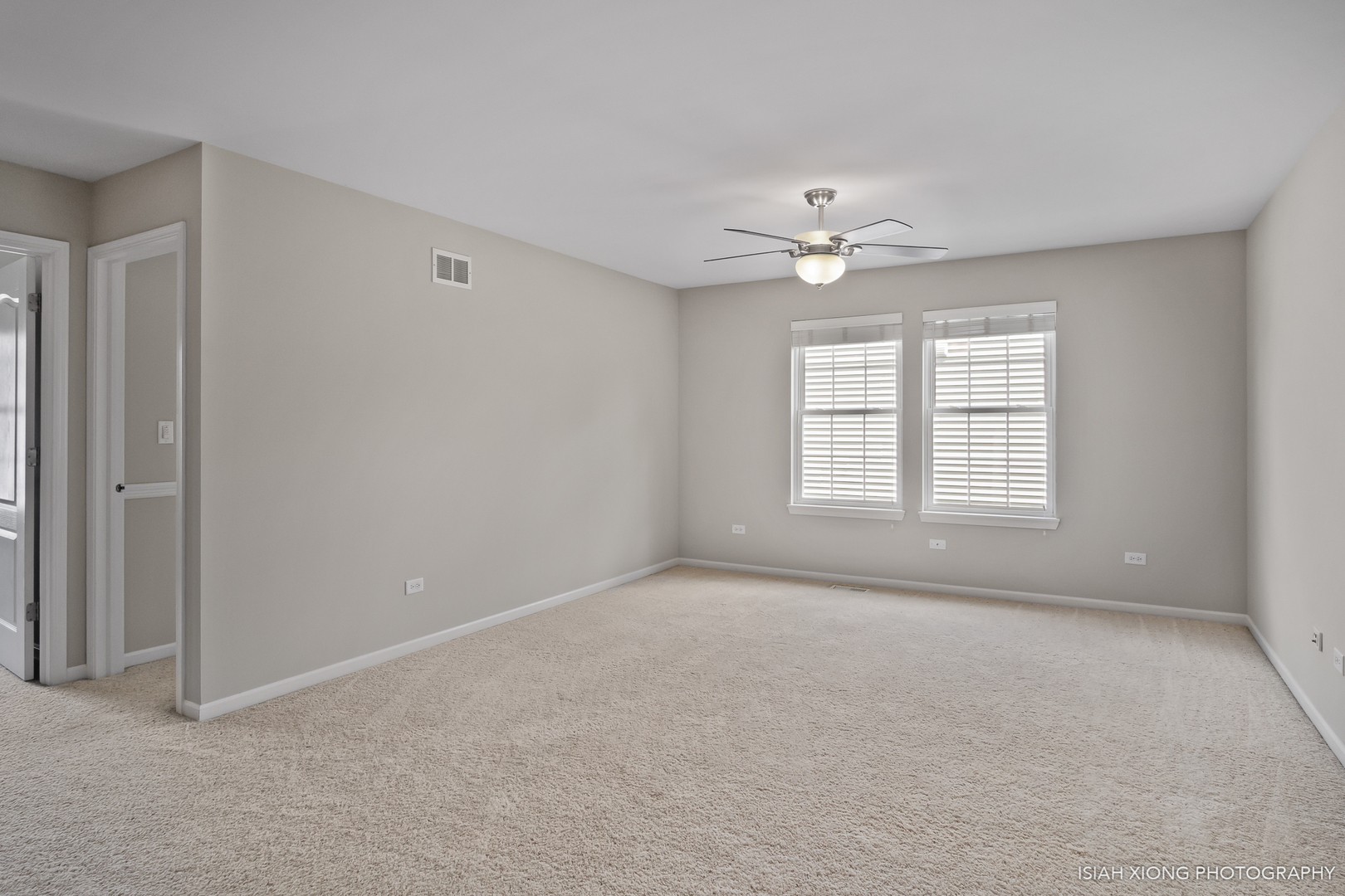 3255 Marbill Farm Road Montgomery, IL 60538 - Photo 8 of 22 a view of an empty room with a ceiling fan and a window