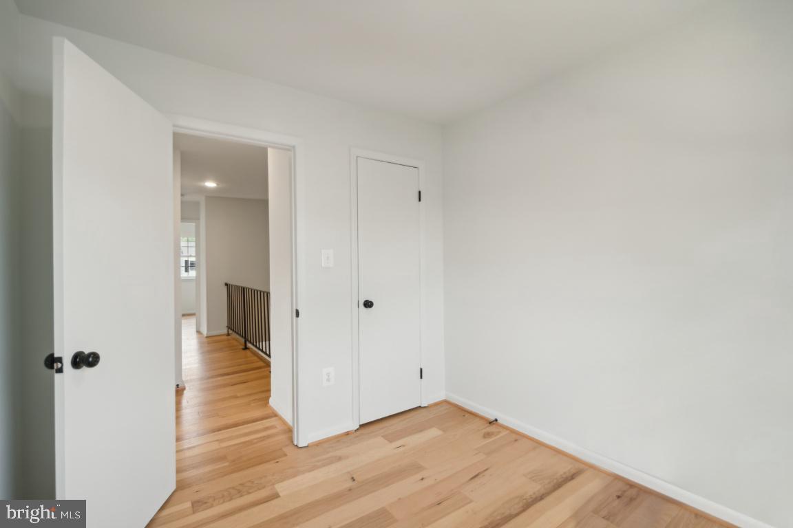 2400 Kilpatrick Place Dumfries, VA 22026 - Photo 11 of 20 a view of a hallway with wooden floor