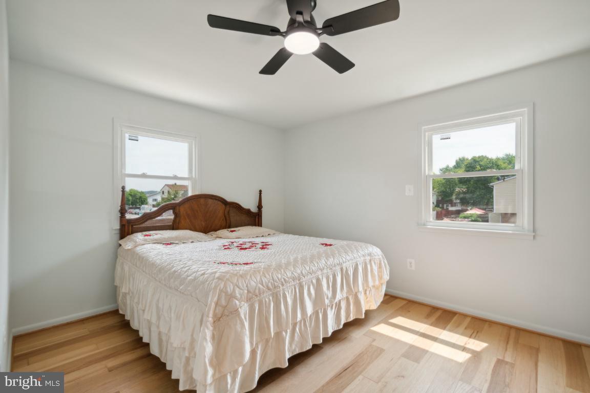 2400 Kilpatrick Place Dumfries, VA 22026 - Photo 12 of 20 a bedroom with a bed and a chandelier
