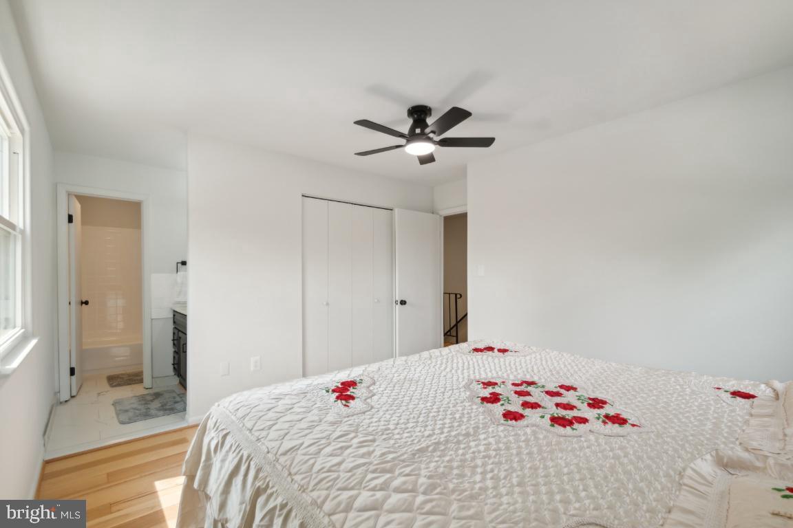 2400 Kilpatrick Place Dumfries, VA 22026 - Photo 13 of 20 a bedroom with a bed and a chandelier