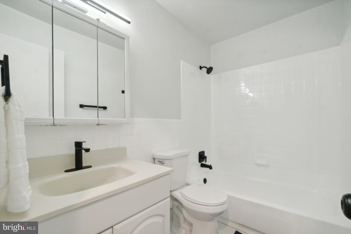 2400 Kilpatrick Place Dumfries, VA 22026 - Photo 15 of 20 a bathroom with a sink a toilet and a bathtub