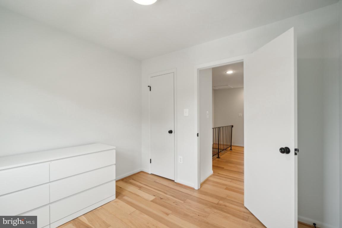 2400 Kilpatrick Place Dumfries, VA 22026 - Photo 17 of 20 a view of an empty room and wooden floor