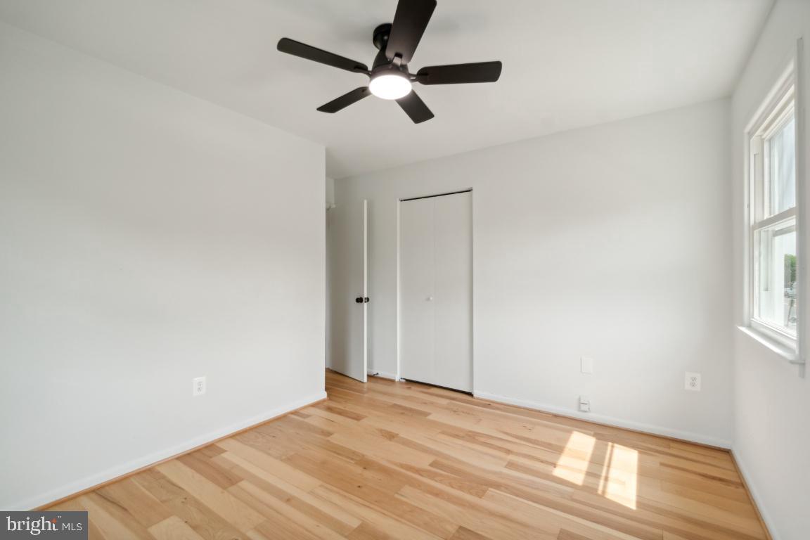 2400 Kilpatrick Place Dumfries, VA 22026 - Photo 19 of 20 a view of empty room with wooden floor and fan