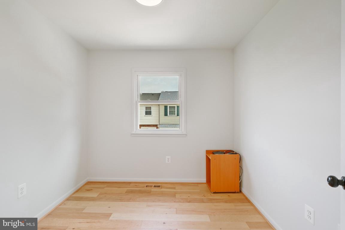 2400 Kilpatrick Place Dumfries, VA 22026 - Photo 10 of 20 a view of a room with wooden floor and fence