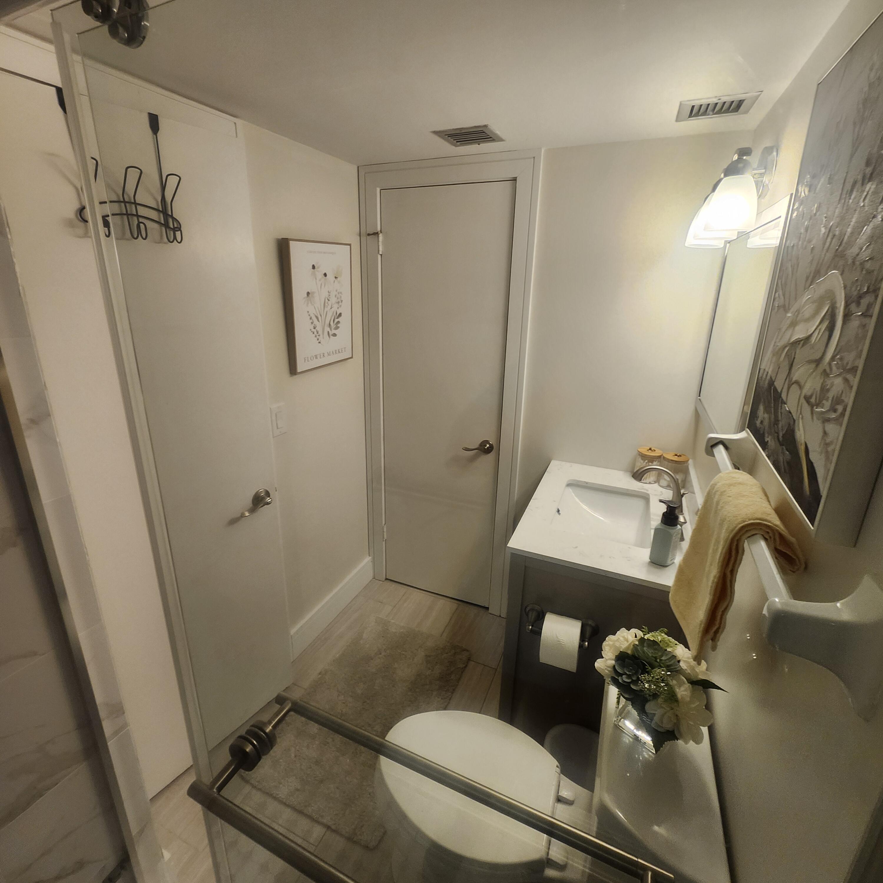 1505 North Riverside Drive, Unit 1108 Pompano Beach, FL 33062 - Photo 11 of 16 a bathroom with a sink toilet and shower