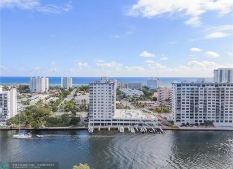 1505 North Riverside Drive, Unit 1108 Pompano Beach, FL 33062 - Photo 16 of 16 a view of a lake with tall building in the background