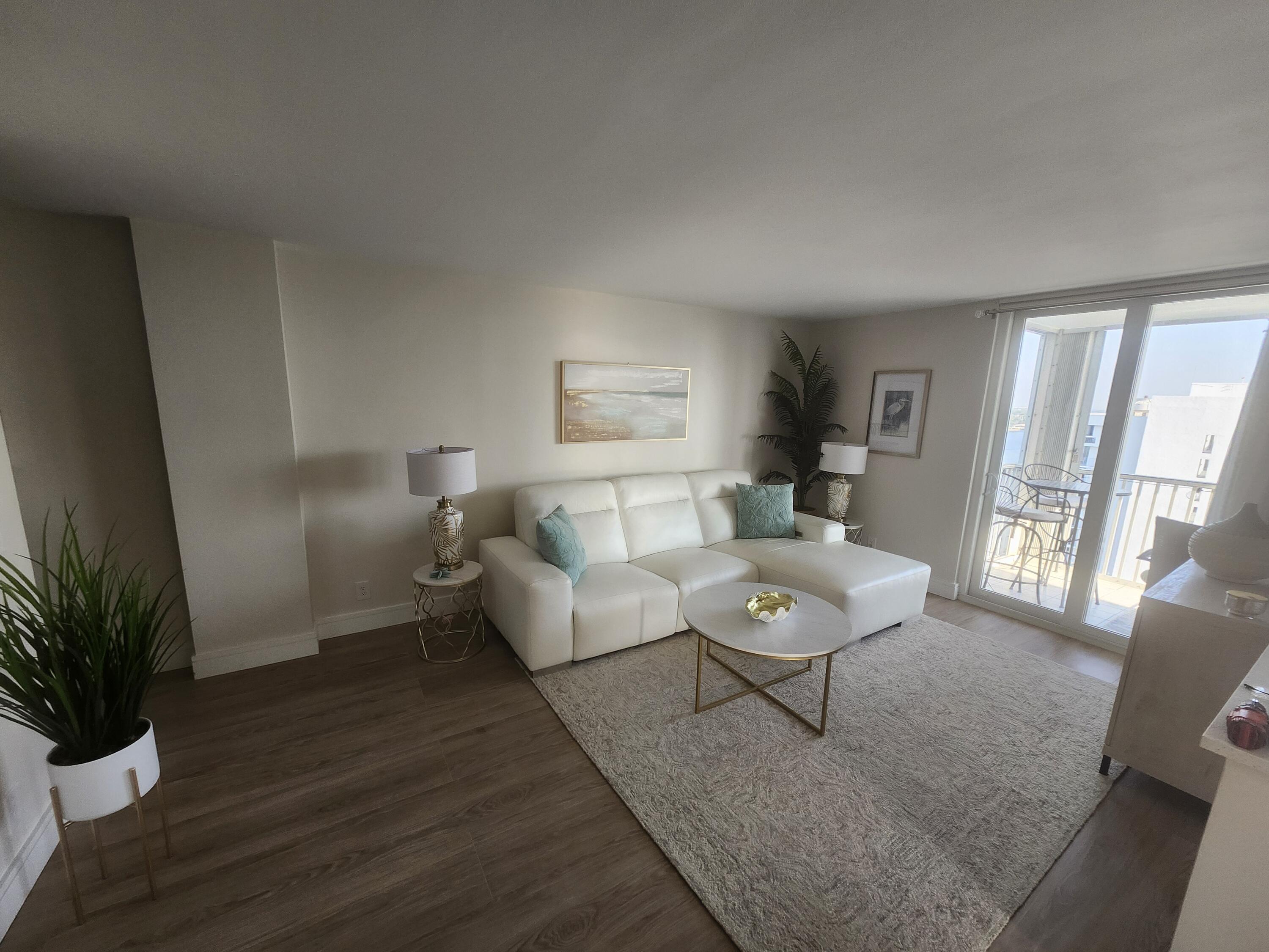 1505 North Riverside Drive, Unit 1108 Pompano Beach, FL 33062 - Photo 4 of 16 a living room with furniture and wooden floor