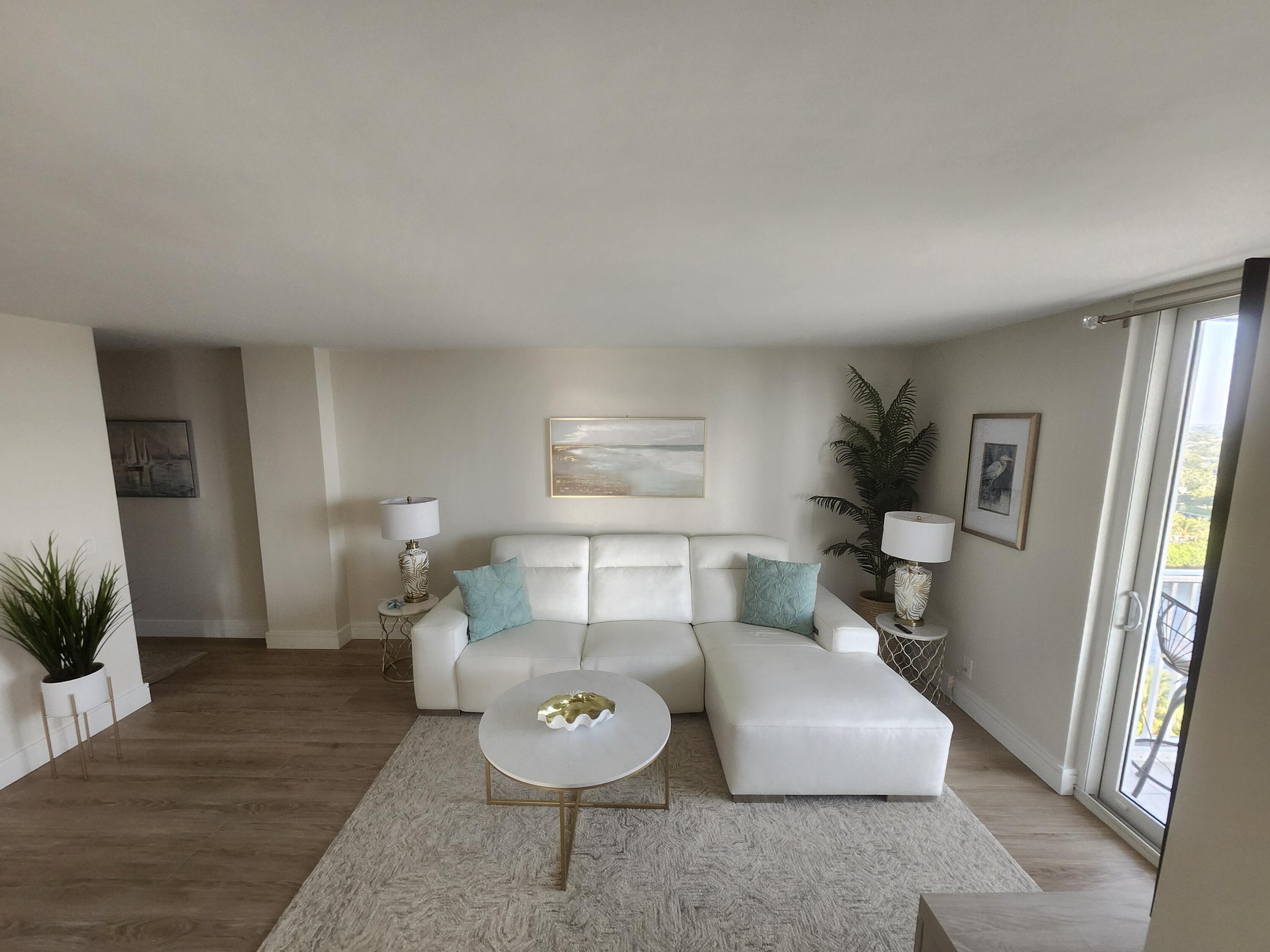 1505 North Riverside Drive, Unit 1108 Pompano Beach, FL 33062 - Photo 6 of 16 a living room with furniture and a wooden floor