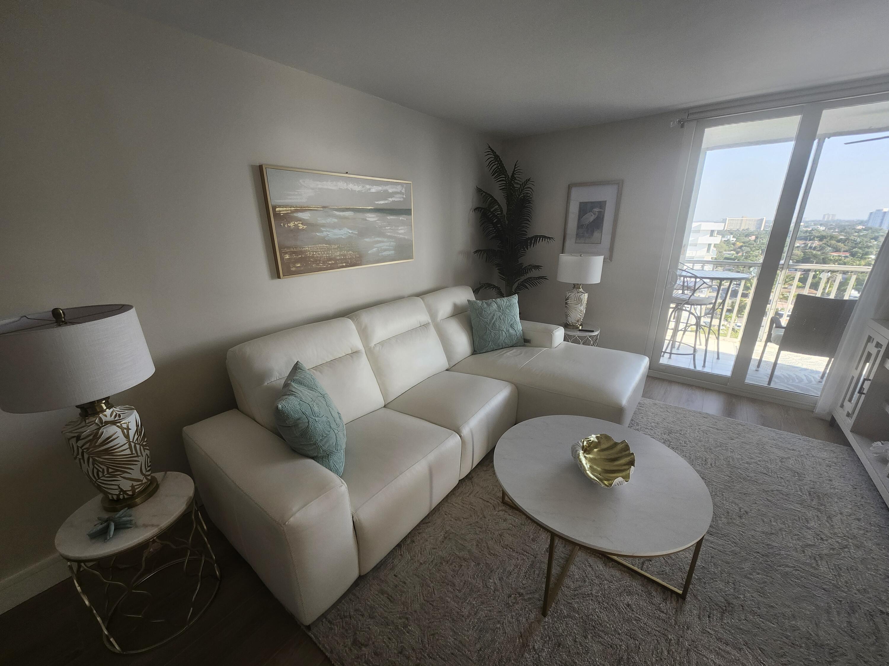 1505 North Riverside Drive, Unit 1108 Pompano Beach, FL 33062 - Photo 7 of 16 a living room with furniture and a table