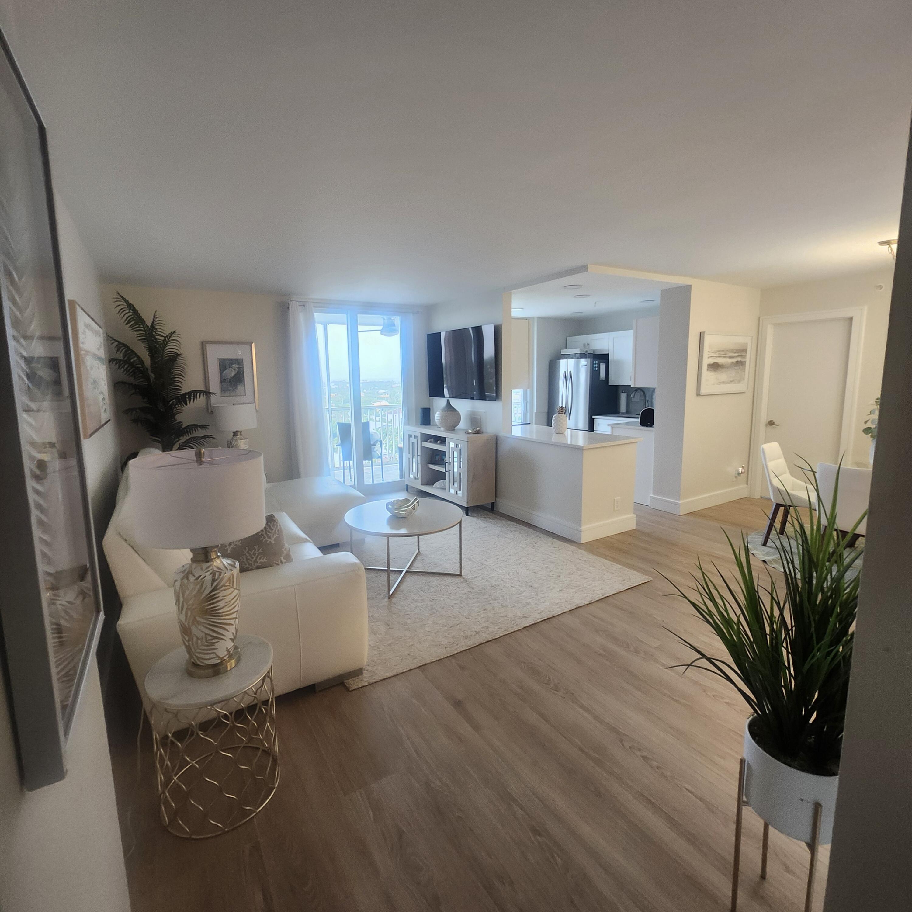 1505 North Riverside Drive, Unit 1108 Pompano Beach, FL 33062 - Photo 8 of 16 a living room with furniture and a large window