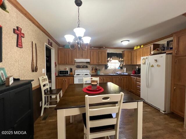 171 Mountain Springs Church Road Macon, GA 31217 - Photo 4 of 13 a kitchen with stainless steel appliances granite countertop a refrigerator a stove a sink dishwasher a dining table and chairs with wooden floor