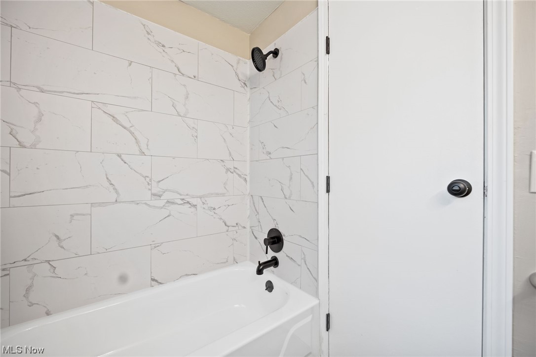 11417 Snow Road Parma Heights, OH 44130 - Photo 14 of 32 Bathroom with tiled shower / bath