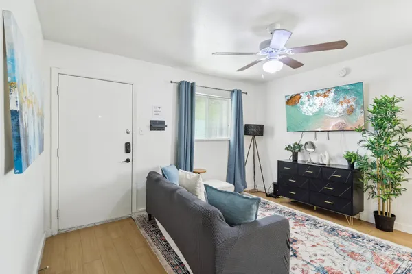 a living room with furniture and a flat screen tv