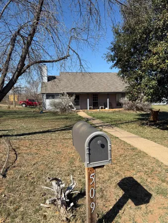 a front view of a house with yard