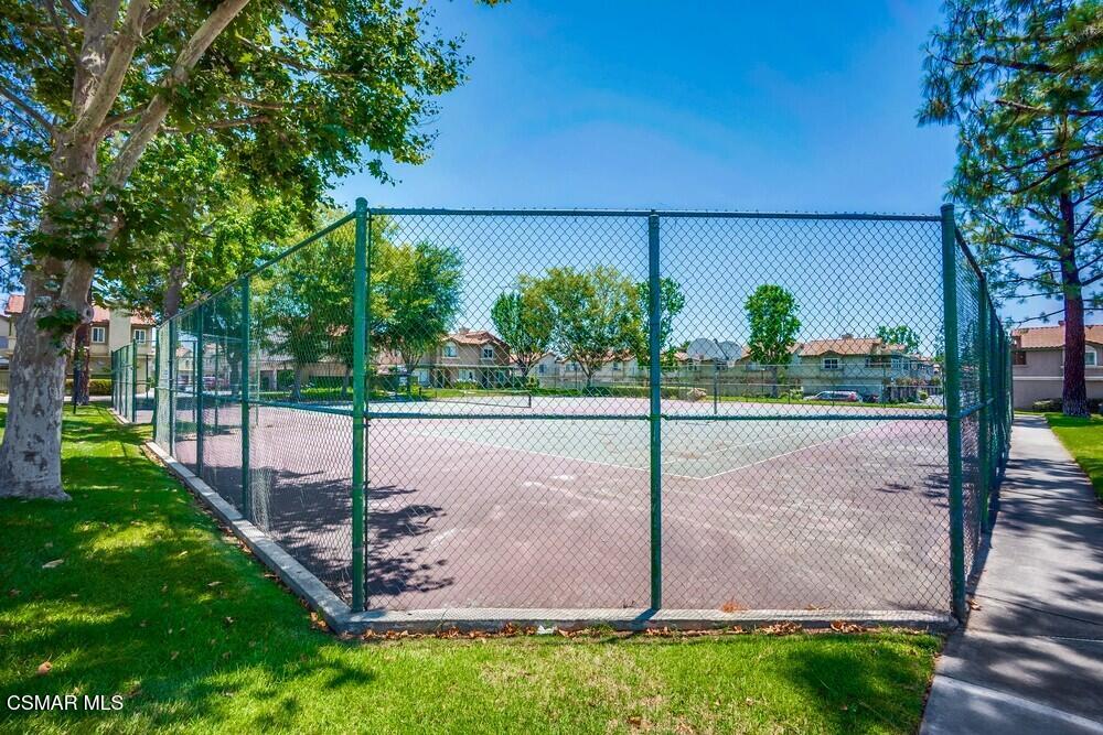8328 Spring Desert Place, Unit E Rancho Cucamonga, CA 91730 - Photo 26 of 27 a view of a street with a large trees