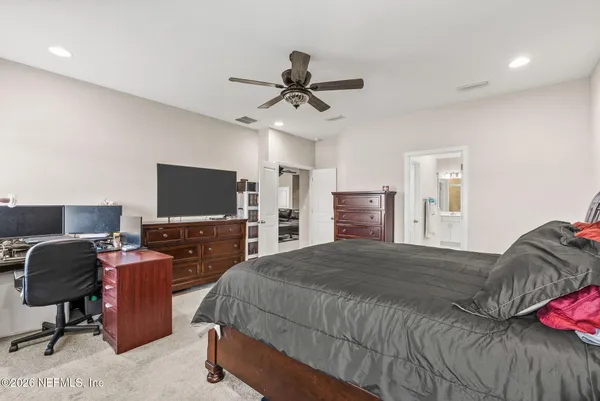 a bathroom with a glass shower door and mirror
