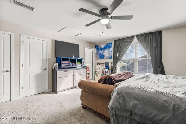a view of a house with pool and a yard