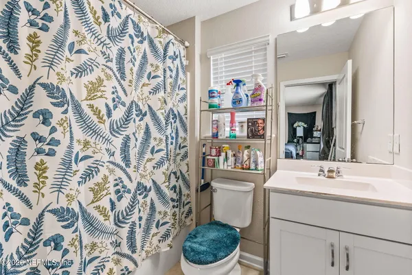 a view of a fire pit with large trees