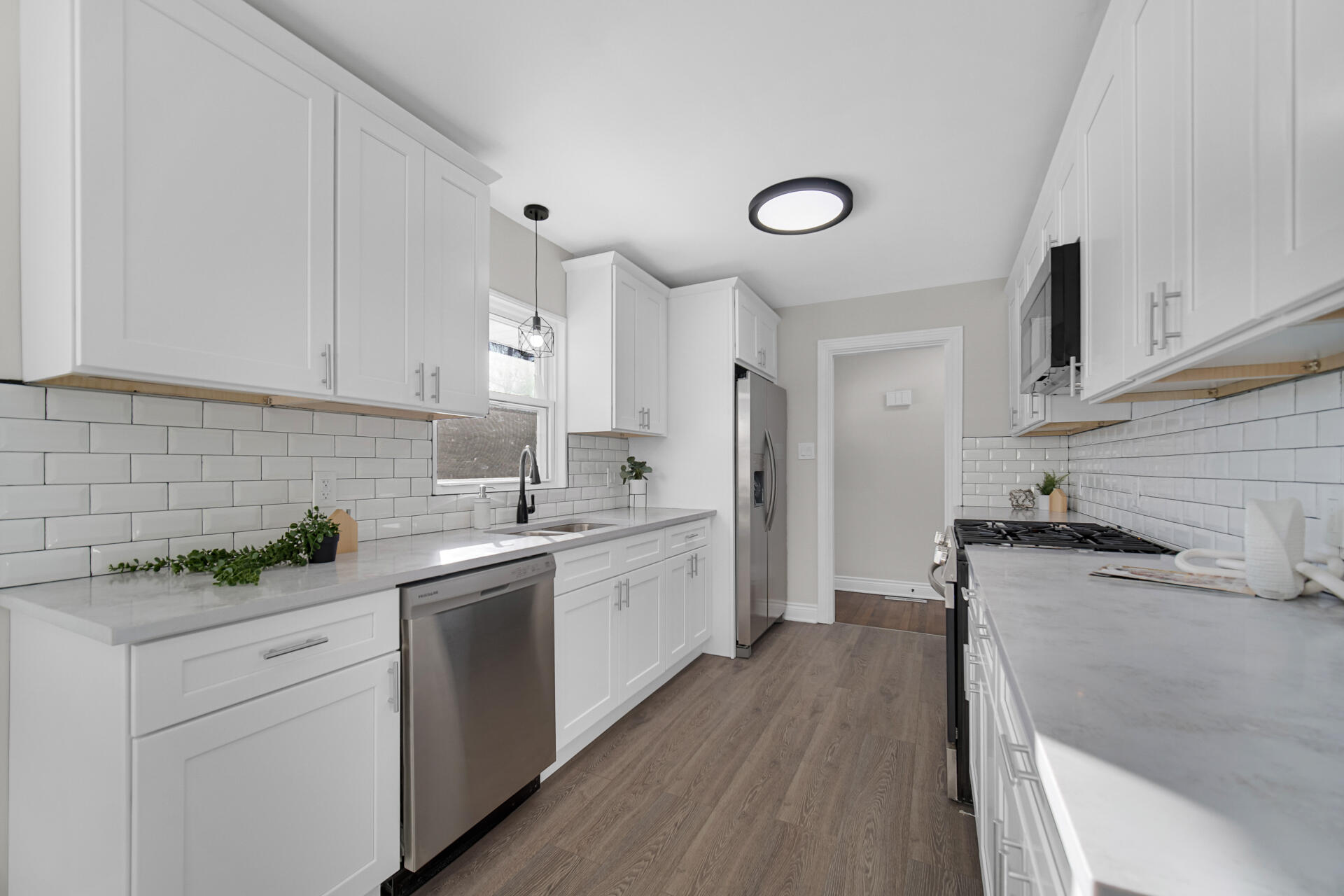 910 High Street Hobart, IN 46342 - Photo 11 of 29 a kitchen with a sink stove and cabinets